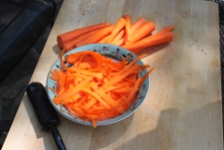 Making carrot salad. I like the color and lighting.